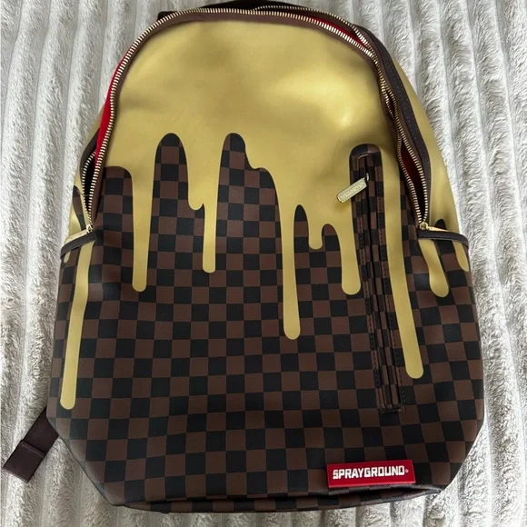 Sprayground Drip Checkered Backpack in Gold and Brown - Picture 1 of 9